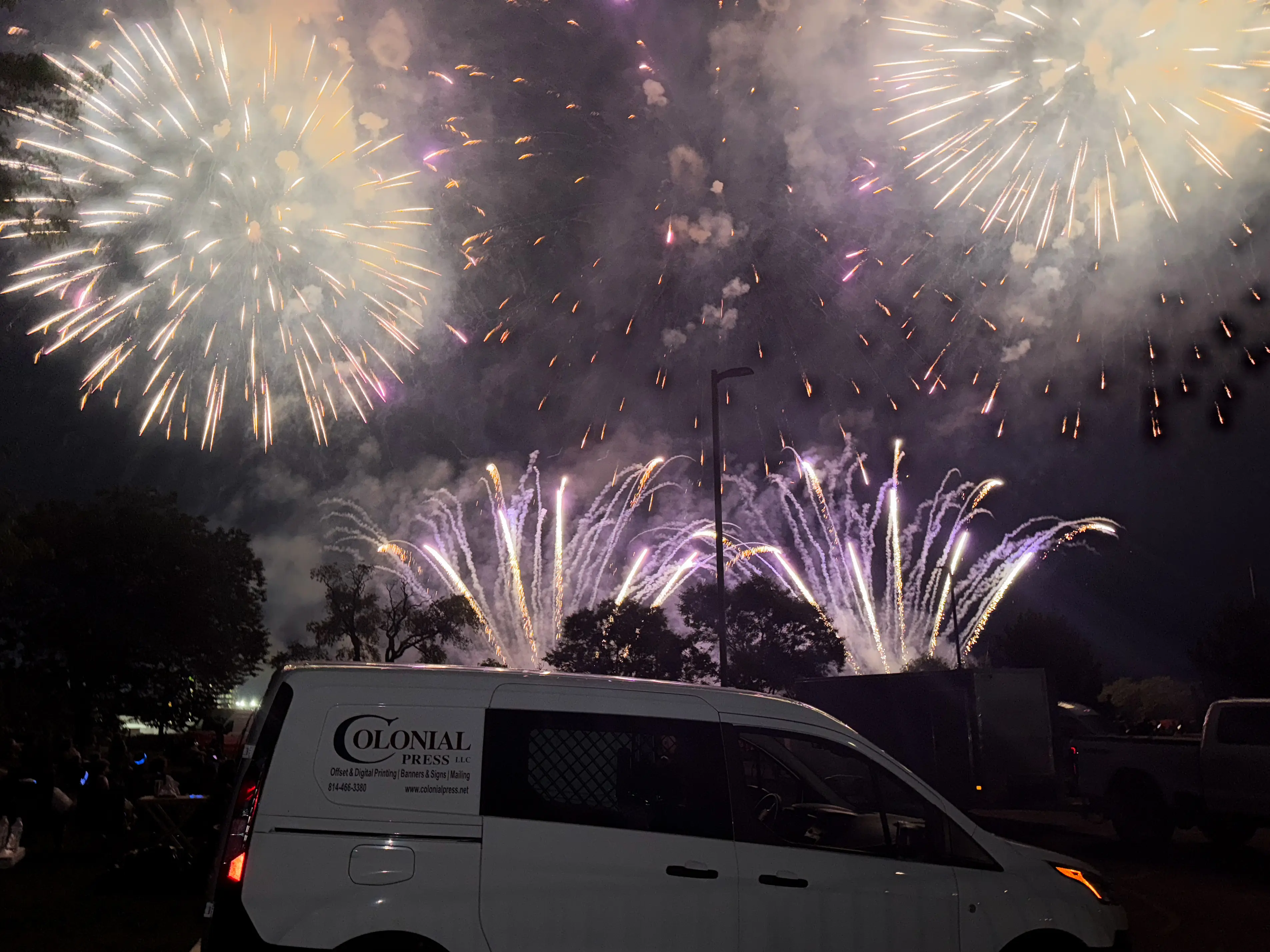 Delivery Van with Fireworks Background